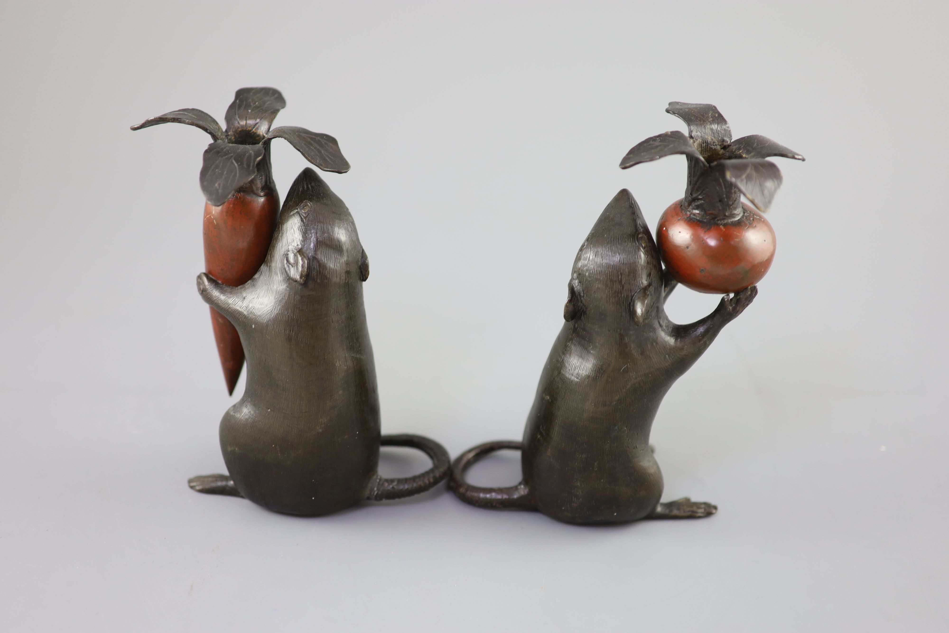 A pair of Japanese bronze rat candlesticks, Meiji period, 16cm and 17cm high